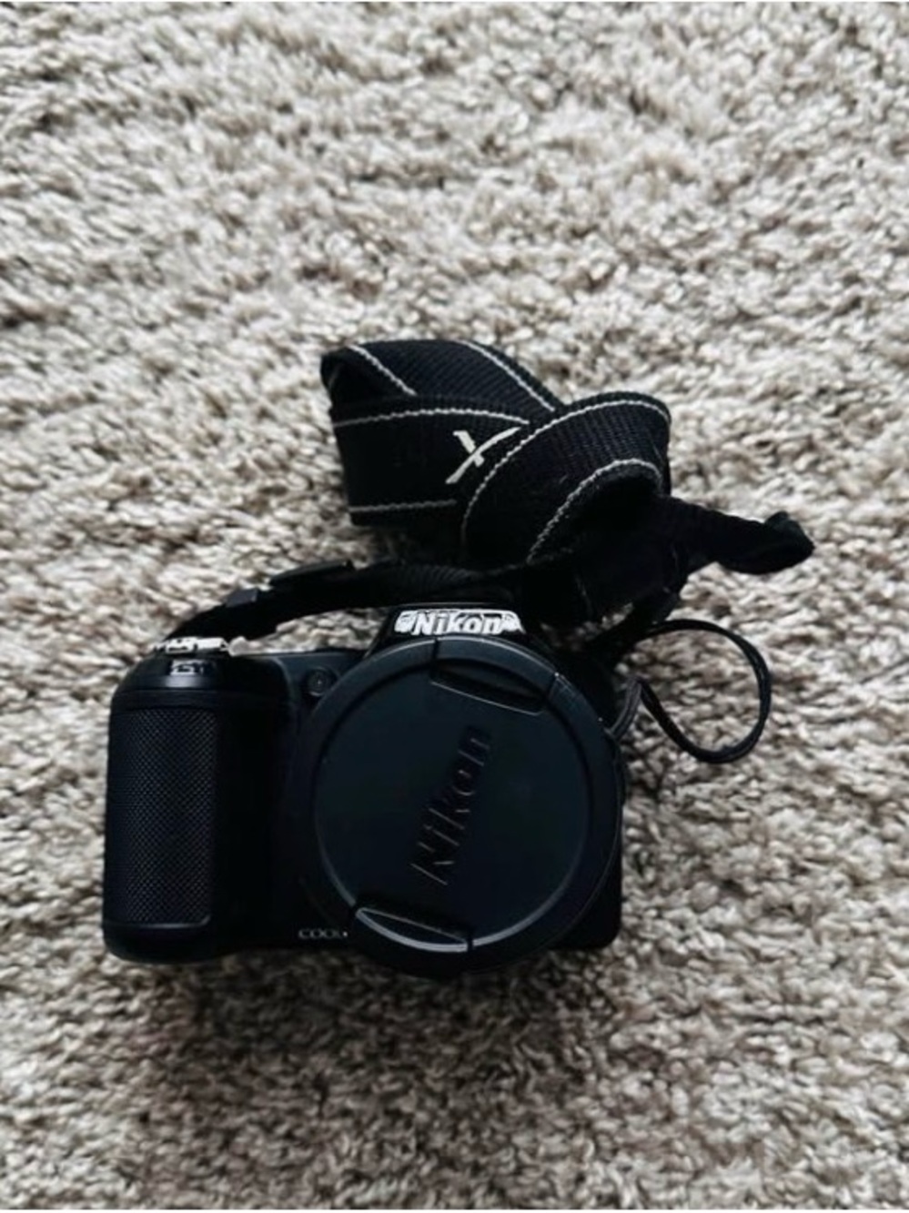 Nikon Black Compact Digital Camera with Neck Strap and Lens Cap